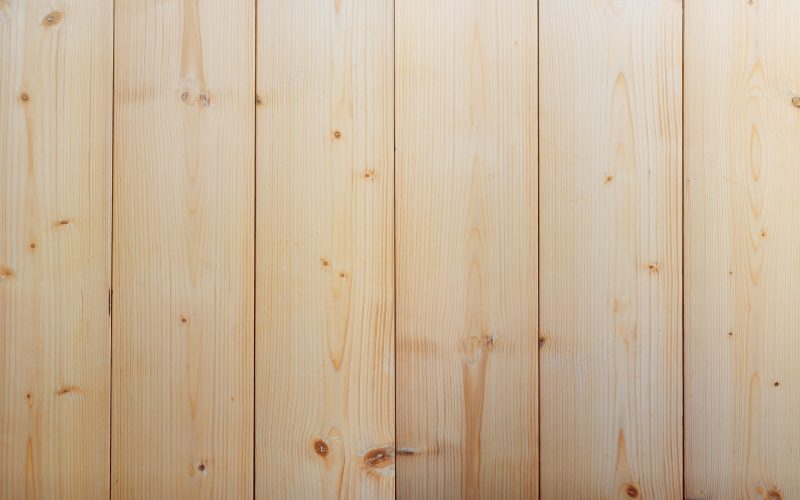 Flat pieces of pine timber joint with clear annual ring used for background.
Wood plank textured ,top view.